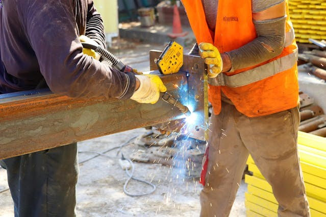 Two men working together.