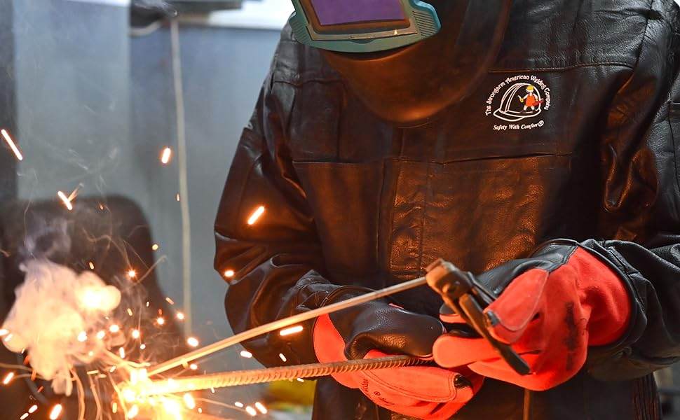 Welder at work wearing Strongarm leather jacket and gloves